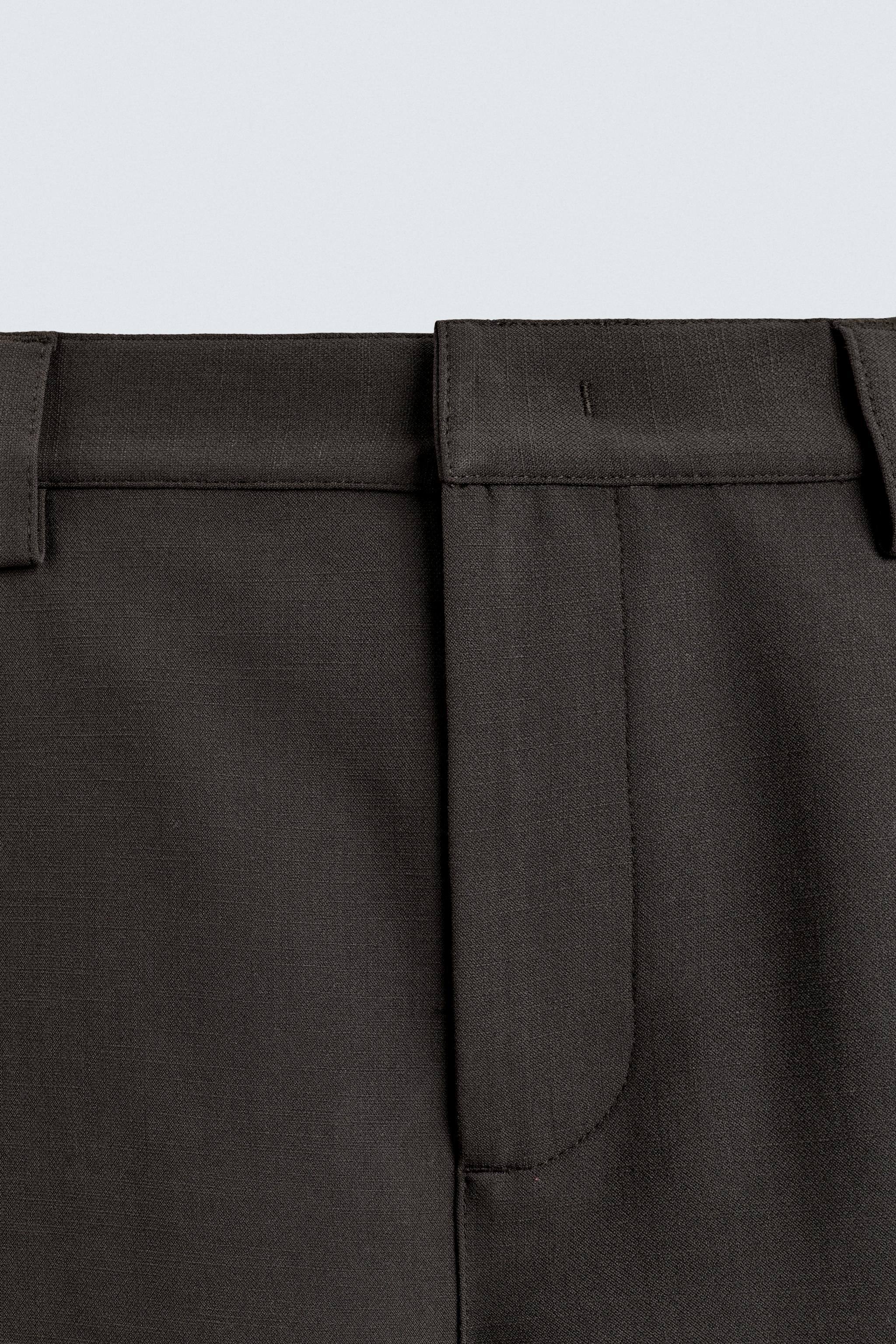BERMUDA RELAXED FIT PLIS LATÉRAUX